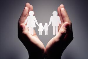 Family Support - Hands holding paper cut-out family